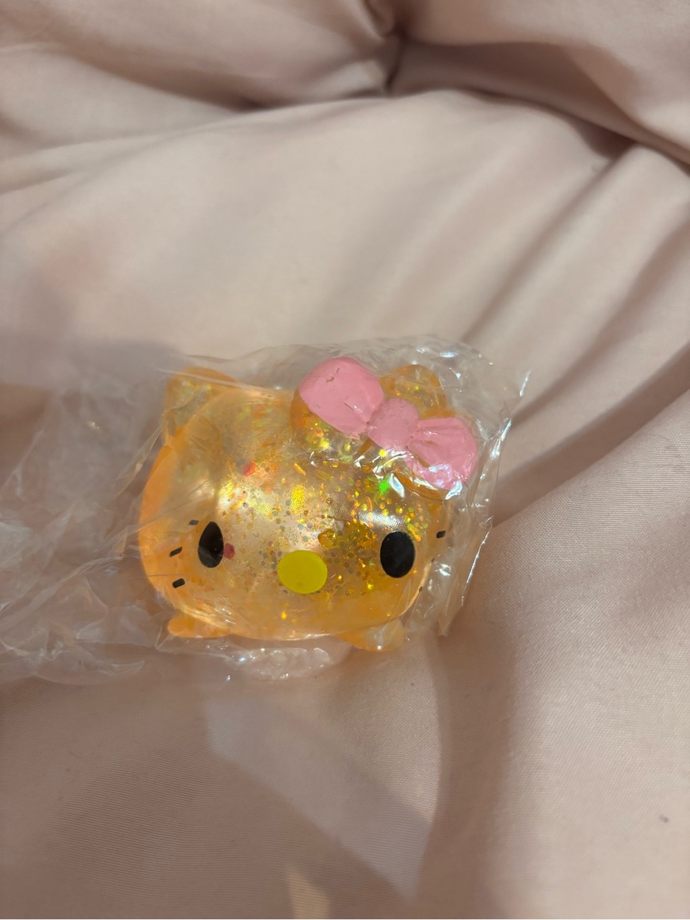 Sanrio Orange Glitter Hello Kitty with Pink Bow squishy